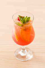 cocktail with orange and strawberry