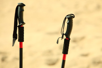nordic walking. sticks on a sandy beach