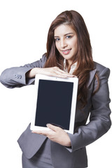 Young businesswoman showing digital tablet