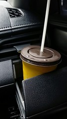 Cold coffee in glass hoder in car
