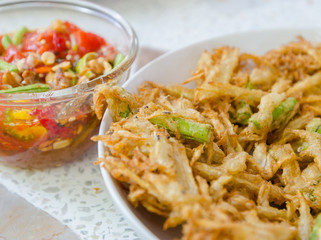 fried papaya and carrot serve with Thai style sauce.