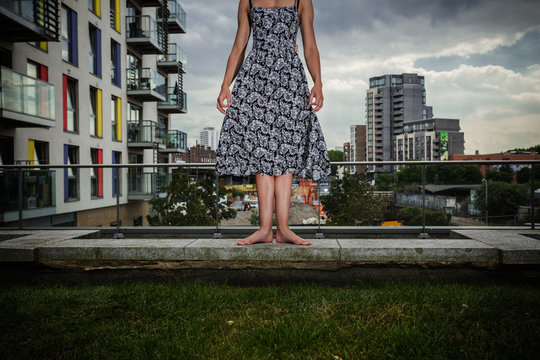 Young woman standing on roof