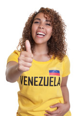 Young woman from Venezuela showing thumb