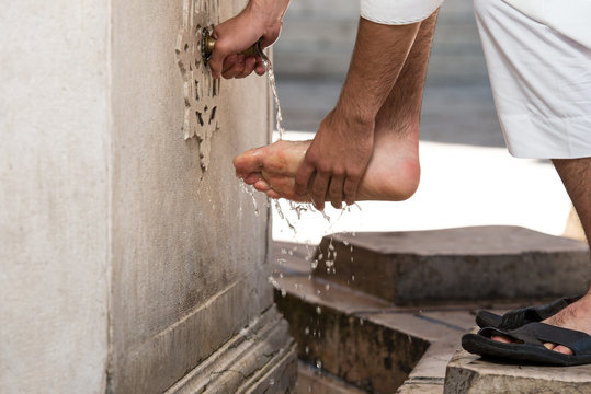 Muslim Washing Feet Before Entering Mosque