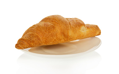 Fresh house croissant on a saucer
