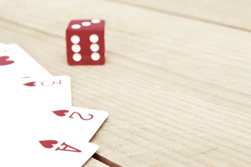 Poker cards with red dice