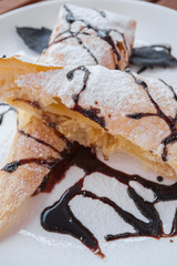 Piece of cherry strudel with chocolate.