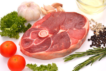 Raw lamb leg ready to be cooked isolated on white