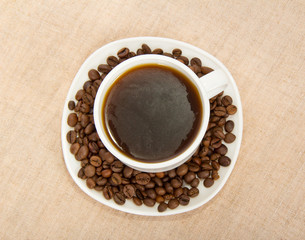 White cup of coffee with grains