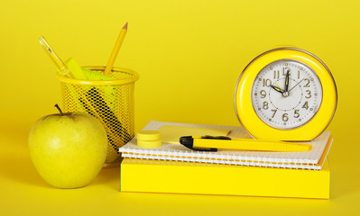 Stationery, books and apple