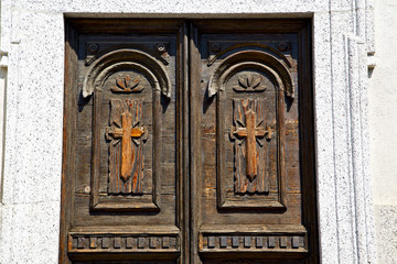 castronno  varese abstract  rusty brass brown knocker in a  door