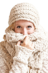 Young woman looking cold and holding her scarf