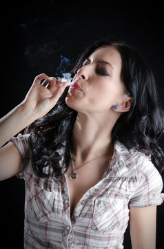 Woman Smoking a Cannabis Joint