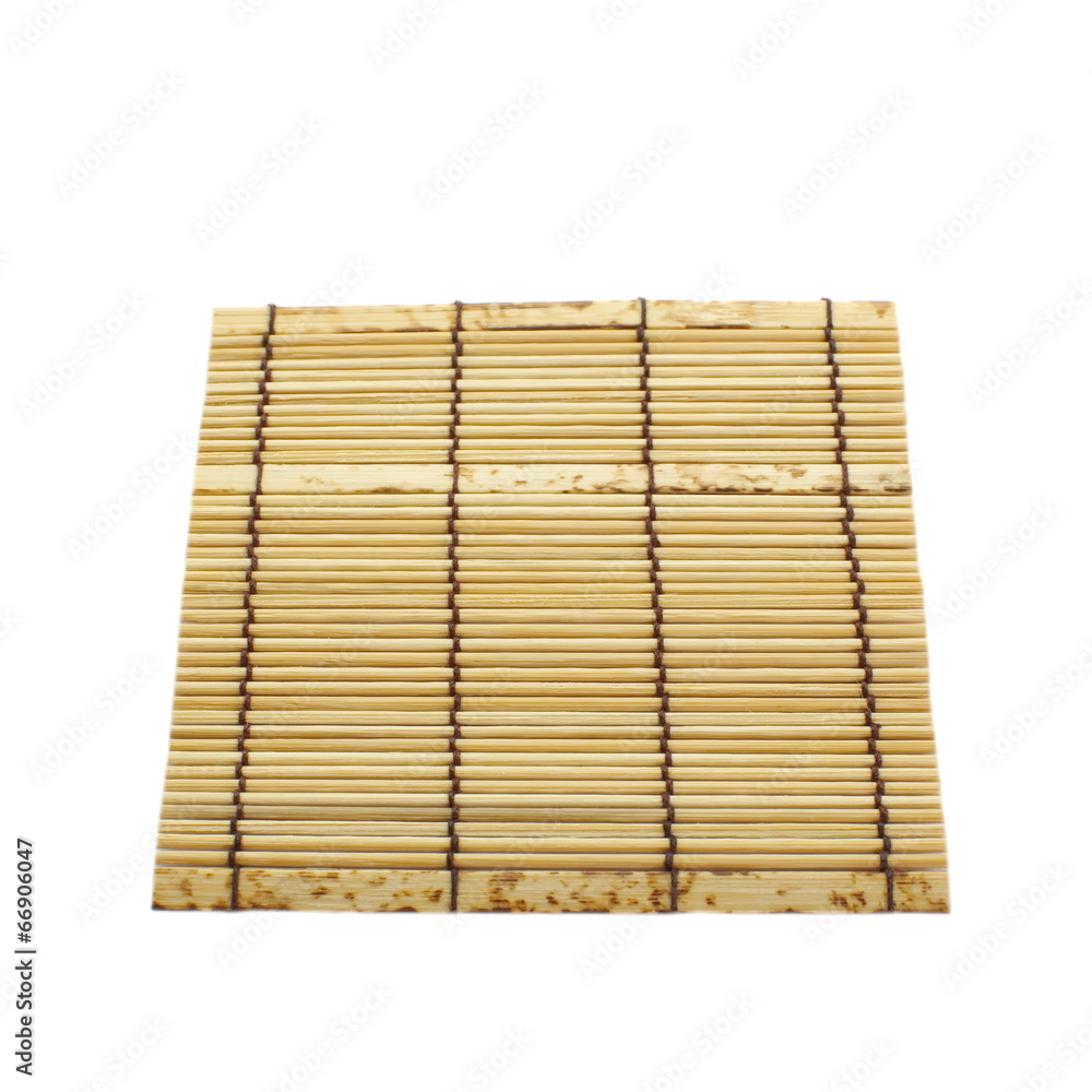 Wall mural Bamboo brown straw serving mat isolated over white background