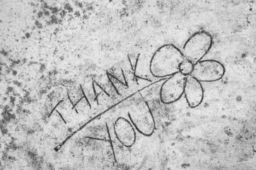 flower sketched on sand background