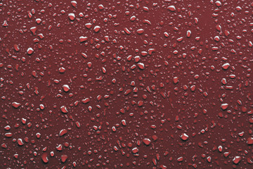 Raindrops on red background