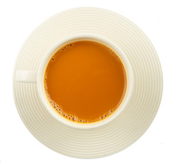 Cup of hot milk tea on white