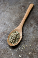 Oregano on a wooden spoon