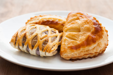 homemade fresh fruit pies on white dish