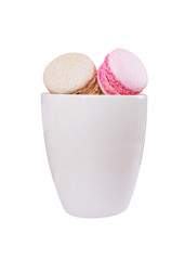traditional french colorful sweet Macaron in cup on white backgr