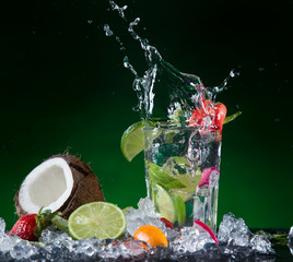 Fototapeta na wymiar Fresh fruit cocktail in freeze motion splashing
