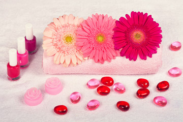 Fototapeta na wymiar Manicure salon, place for manicure with towel, gerbera flowers