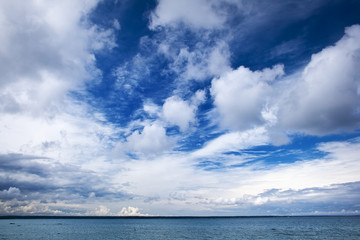 Naklejka na ściany i meble Blue sky with clouds at the sea