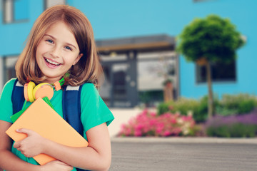 Back to school - portrait of beautiful young schoolgirl