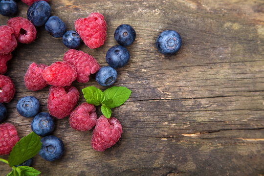 Fresh Berries On A Wooden Table