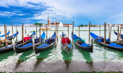 Fototapeta na wymiar Gondolas moored by San Marco square, Venice