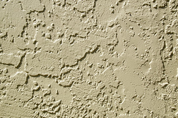 painted stucco wall abstract background in sunshine