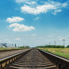 Obraz premium railroad closeup and clouds in blue sky