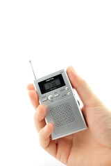 Hand holding a transistor radio