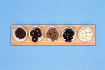 Taster dishes of assorted chocolates