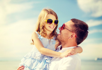 happy father and child girl having fun outdoors