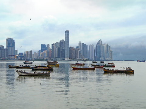 Skyscrapers and fishing boats