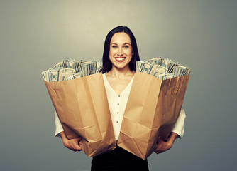 excited businesswoman with money
