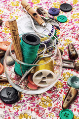 thread,button,crochet hook, and other sewing tools