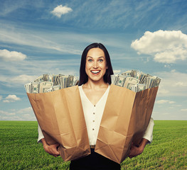 excited young woman holding bag
