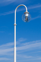 Fototapeta na wymiar Street lamp in front of blue sky
