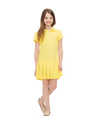 smiling little girl in yellow dress
