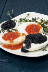 chicken egg with red and black caviar