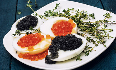 chicken egg with red and black caviar