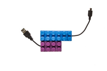 blue and purple building blocks with usb cables