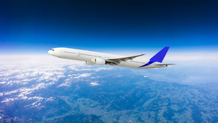 Fototapeta na wymiar Airplane over the clouds
