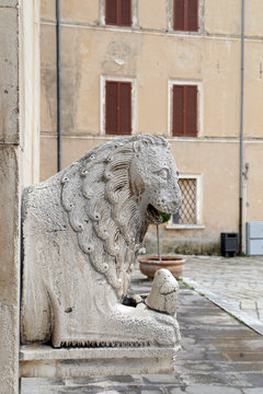 detail of a medieval portal in italy. collegiate church, visso