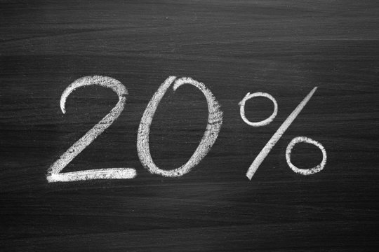 20-percent header written with a chalk on the blackboard - Powered by Adobe