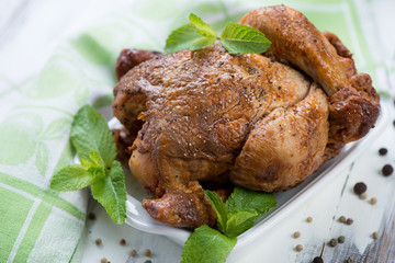 Close-up of a whole smoked chicken, horizontal shot