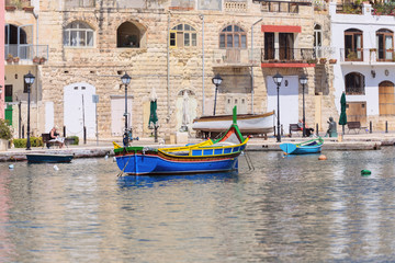 Fototapeta na wymiar fishermen boat in Spinola bay at Malta
