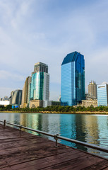 Obraz premium Modern buildings on blue sky with lake